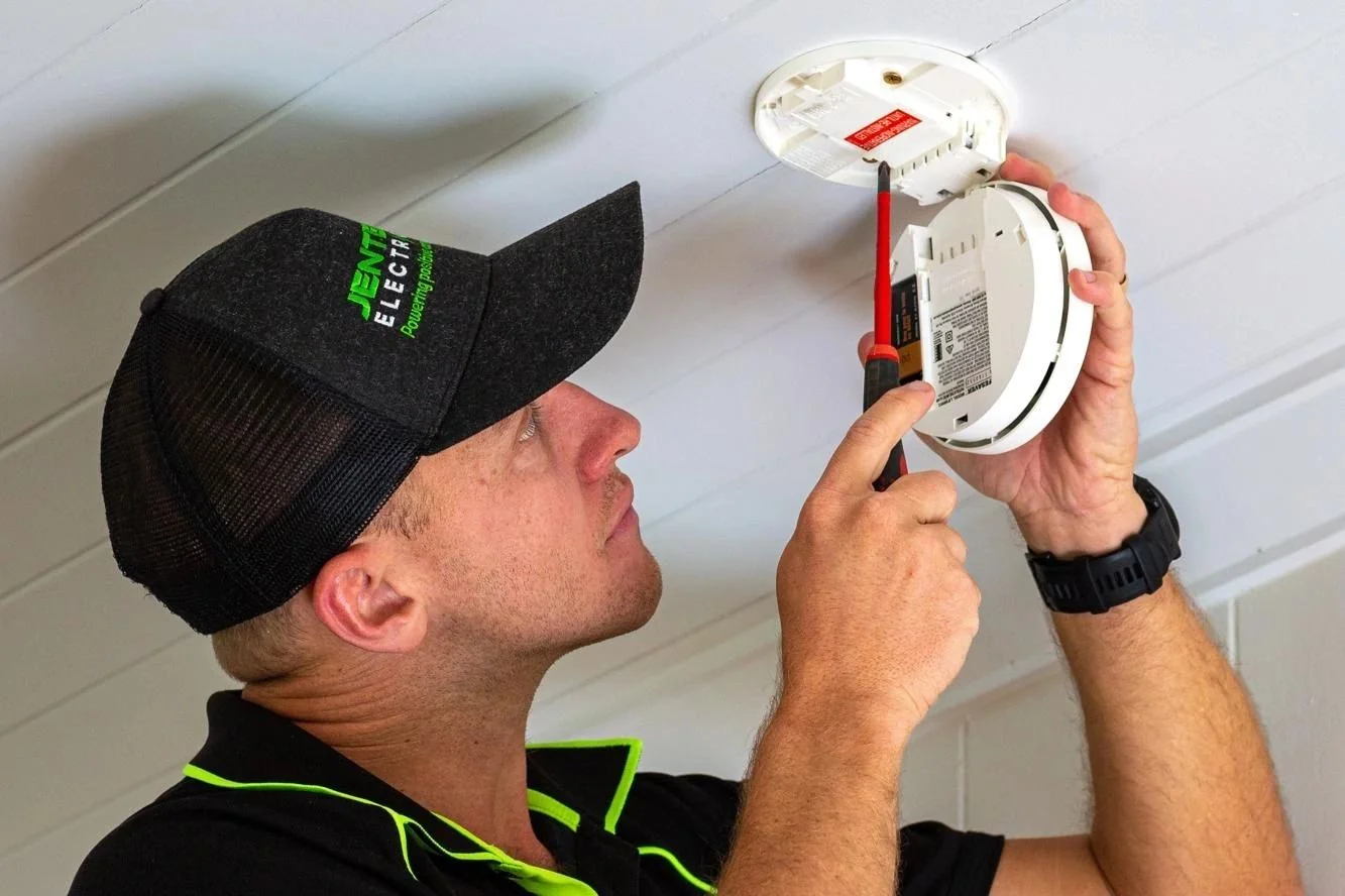 Interconnected photoelectric smoke alarm installed on a Brisbane ceiling
